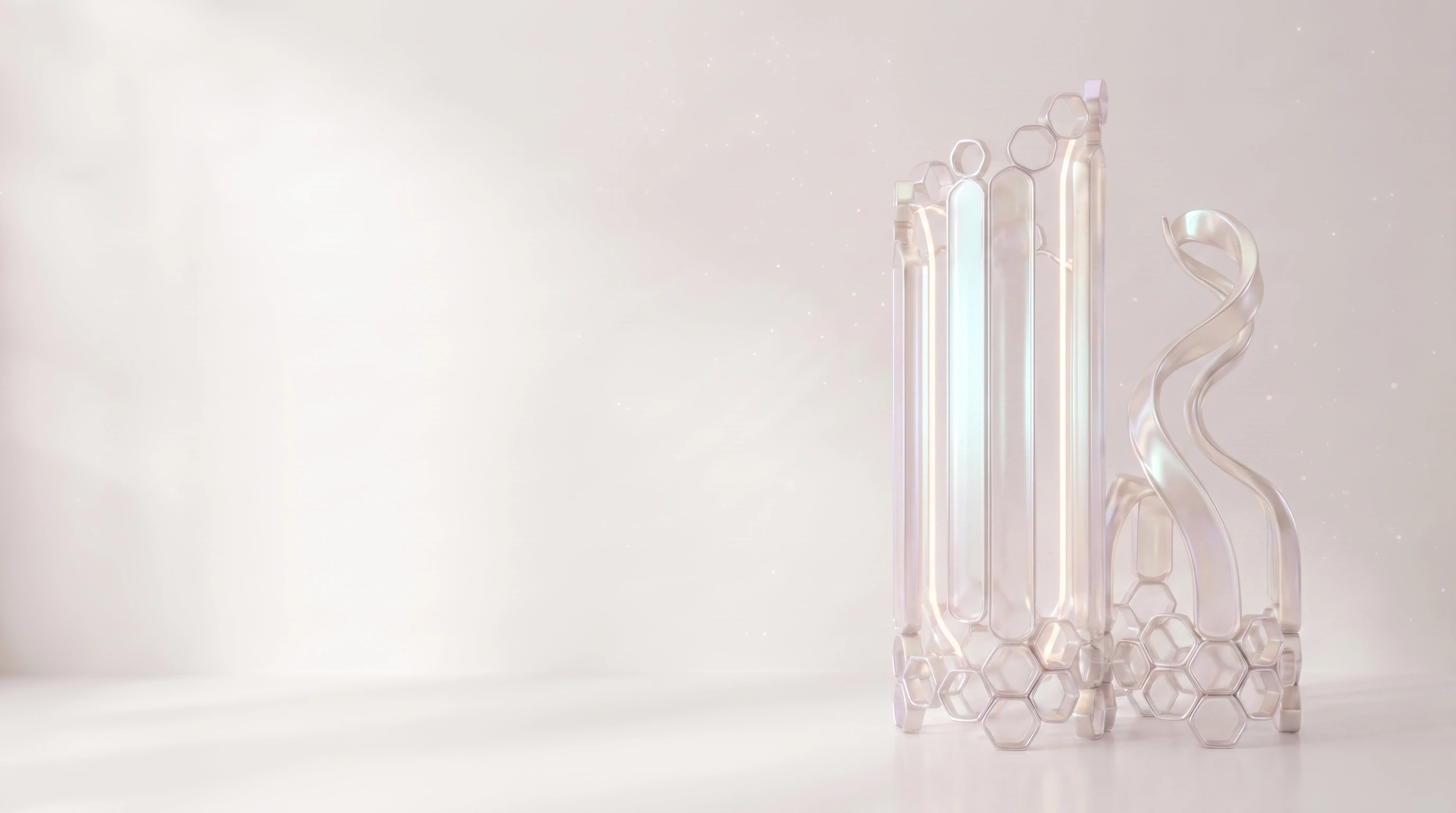 Two pearlescent forms standing side by side — one fully resolved into hexagonal cells, one still part ribbon at the top — the same material shown at two stages for comparison.